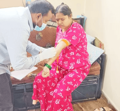 Propath Lab technician collecting a blood sample at a patient's home